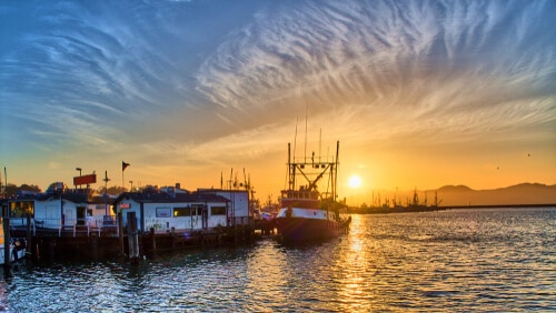 Fishing boat sunset pier
