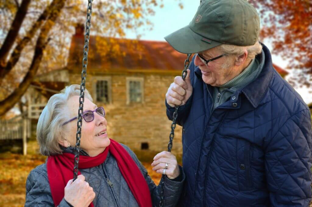 mature couple at swing set