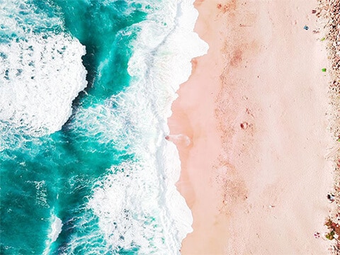 Aerial shot of surf and beach