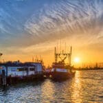 Fishing boat sunset pier