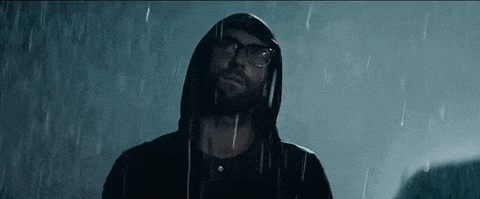Man in the rain with wet glasses since he didn't get refractive lens surgery.