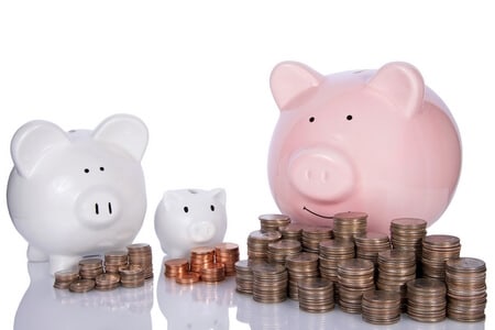 Three piggy banks with coins