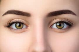 Close up woman brown eyes