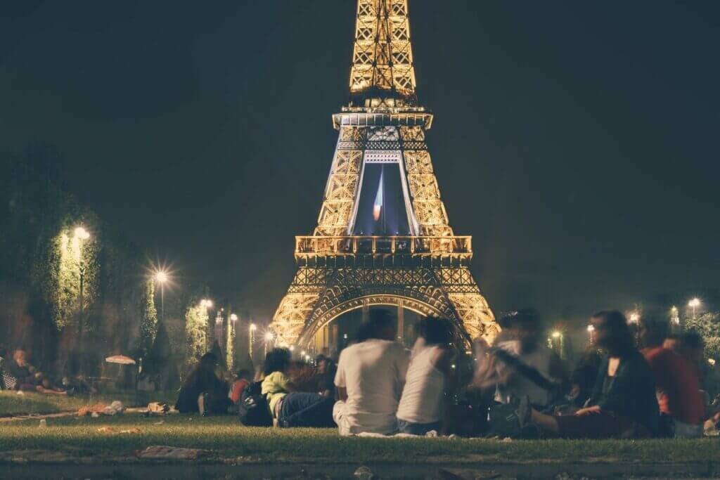 group in front of eiffel tower