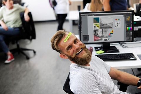 Happy employee at desk