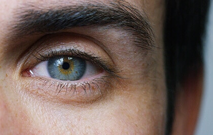 Close up men's blue eye