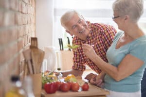 older couple sharing food 