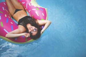 girl floating in pool