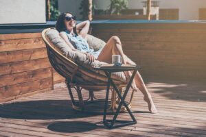 woman sitting in chair outside