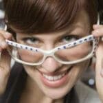 stylish woman looking over glasses