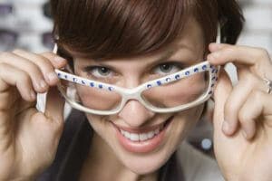 stylish woman looking over glasses