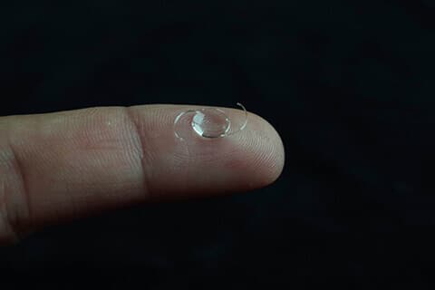 Visian ICL on fingertip