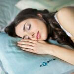 woman sleeping on pillow